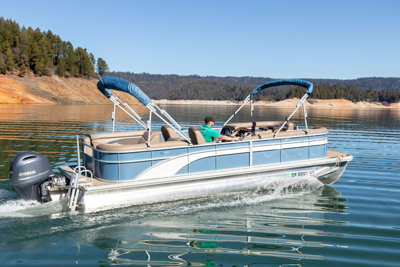 Family enjoying a sunny and adventurous lake vacation at Emerald Cove Marina.