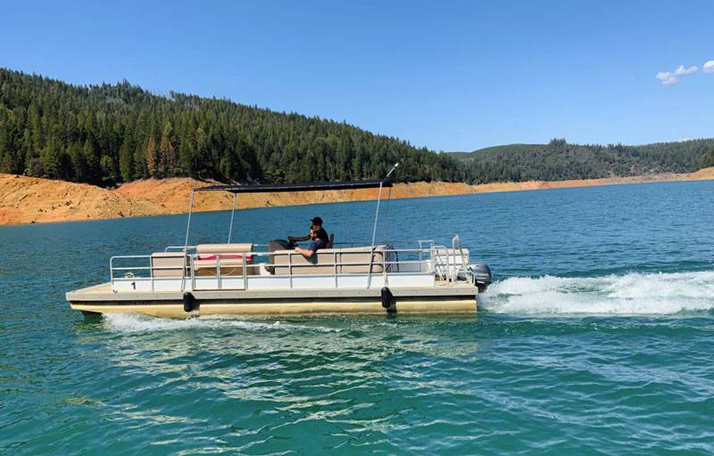Enjoying a premium boat rental on the deep, glass-smooth waters of Bullards Bar Reservoir.