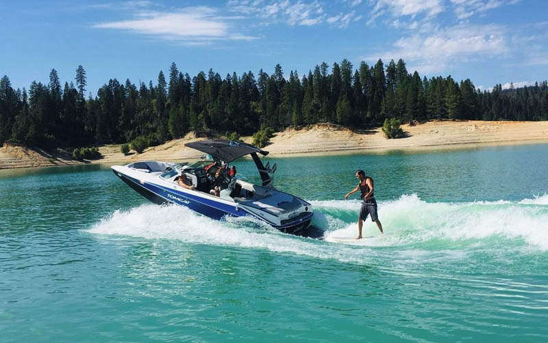 Premium ski boat and pontoon rentals waiting at the docks of Emerald Cove Marina.