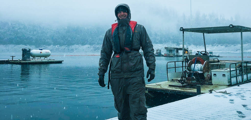 Emerald Cove Marina standing on the docks in the snowy day smiling